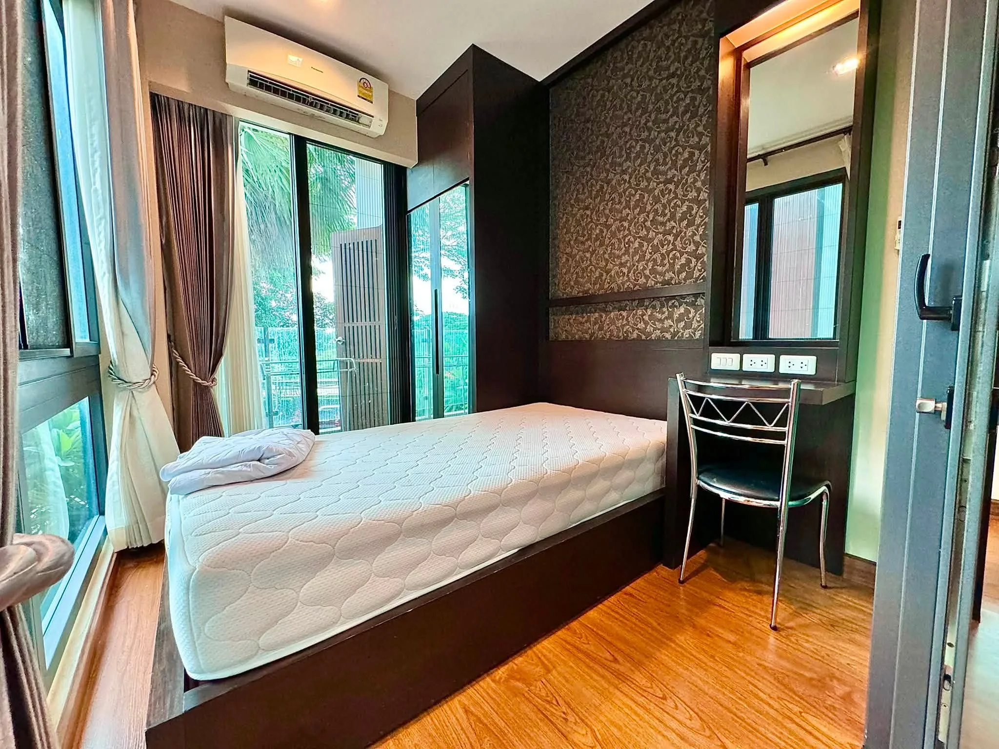 Bedroom interior in a 2-bedroom condo at Himma Garden Condominium in Chiang Mai